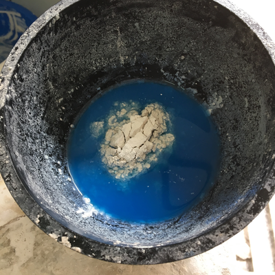 Mixing dry plaster with water and methylene blue.  HVP-Gatagara | Gatagara, Rwanda.  