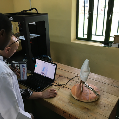 Issac Rukundo, director of the P&O department at HVP-Gatagara, and Roberto Postelmans, director of ORTHOLAB, 3D scanning a plaster cast.  ORTHOLAB | Gatagara, Rwanda.  