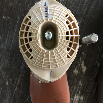 Off-the-shelf alignment module fitted onto the 3D printed prosthetic foot.  HVP-Gatagara | Gatagara, Rwanda.