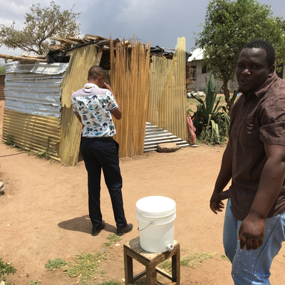 Rajab Hamis, washing his hands outside of Mama Mzuka's Lunch Shack.  Lake Victoria Disability Centre | Musoma, Tanzania.