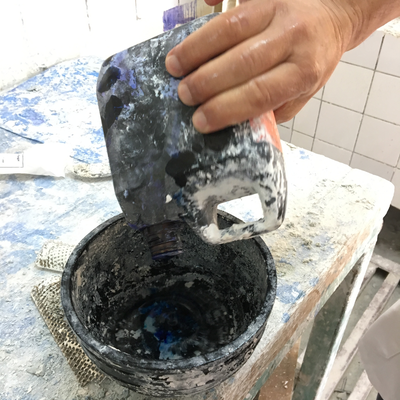 Roberto Postelmans mixing dye into plaster to process a plaster cast.  HVP-Gatagara | Gatagara, Rwanda.  