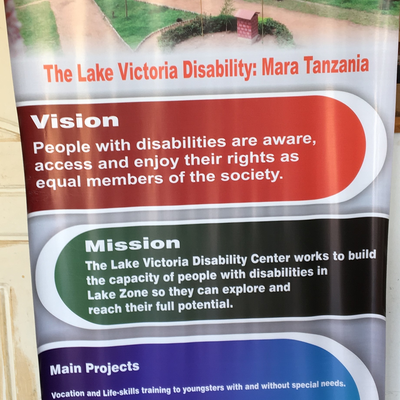 A banner detailing the vision and mission of LVDC.  Lake Victoria Disability Centre | Musoma, Tanzania.