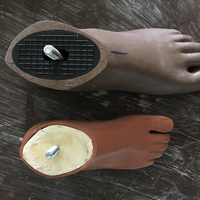 Above:  Off-the-shelf prosthetic foot.  Below:  3D printed prosthetic foot designed by Roberto Postelmans.  HVP-Gatagara | Musoma, Tanzania.  