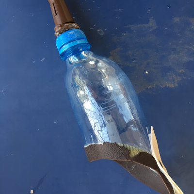 A custom prosthetic for a bilateral upper limb amputee, with a thermoformed water bottle socket and 3D printed end effector.  Lake Victoria Disability Centre | Musoma, Tanzania.  