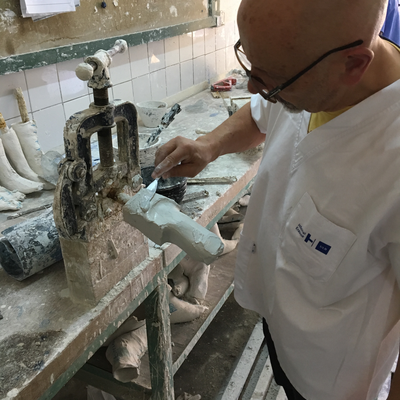 Roberto Postelmans processing a plaster cast.  HVP-Gatagara | Gatagara, Rwanda.  
