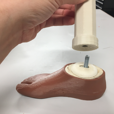 3D printed prosthetic foot designed by Roberto Postelmans, connected with 3D printed hardware to a 3D printed pylon designed by Kyle Reeser.  HVP-Gatagara | Musoma, Tanzania.  