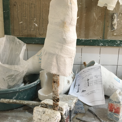 A plaster cast being processed by Roberto Postelmans.  HVP-Gatagara | Gatagara, Rwanda.  