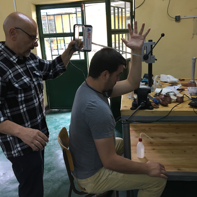 Roberto Postelmans demonstrating the difficulty of 3D scanning a hand.  ORTHOLAB | Gatagara, Rwanda.  