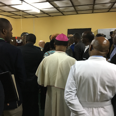 Roberto Postelmans explaining 3D printed prosthetics to visitors at ORTHOLAB.  HVP-Gatagara | Gatagara, Rwanda.  