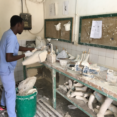 A technician in the P&O department at HVP-Gatagara processing a plaster cast.  HVP-Gatagara | Gatagara, Rwanda.  