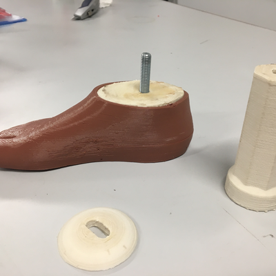 3D printed prosthetic foot designed by Roberto Postelmans, connected with 3D printed hardware to a 3D printed pylon designed by Kyle Reeser.  HVP-Gatagara | Musoma, Tanzania.  
