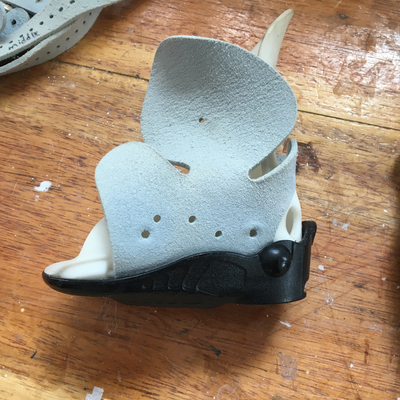 Side view of an off-the-shelf foot abduction brace with rivets removed.  Lake Victoria Disability Centre | Musoma, Tanzania.  