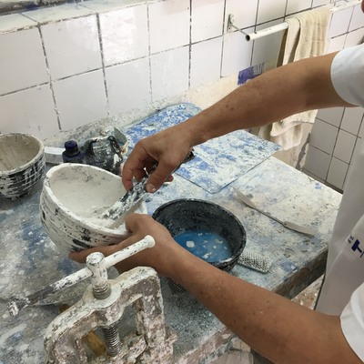 Roberto Postelmans mixing plaster to process a plaster cast.  HVP-Gatagara | Gatagara, Rwanda.  