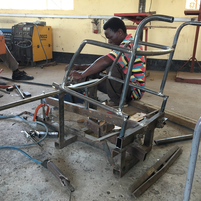 An LVDC staff member, himself disabled, welding a custom wheelchair.  Lake Victoria Disability Centre | Musoma, Tanzania.