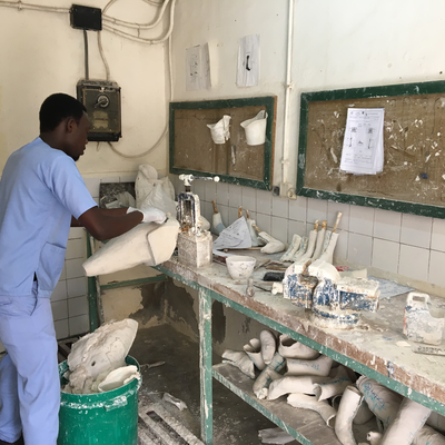 A technician in the P&O department at HVP-Gatagara processing a plaster cast.  HVP-Gatagara | Gatagara, Rwanda.  